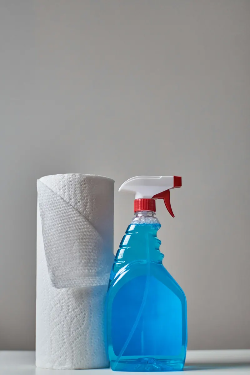 A labelled spray bottle and cloth ready for cleaning