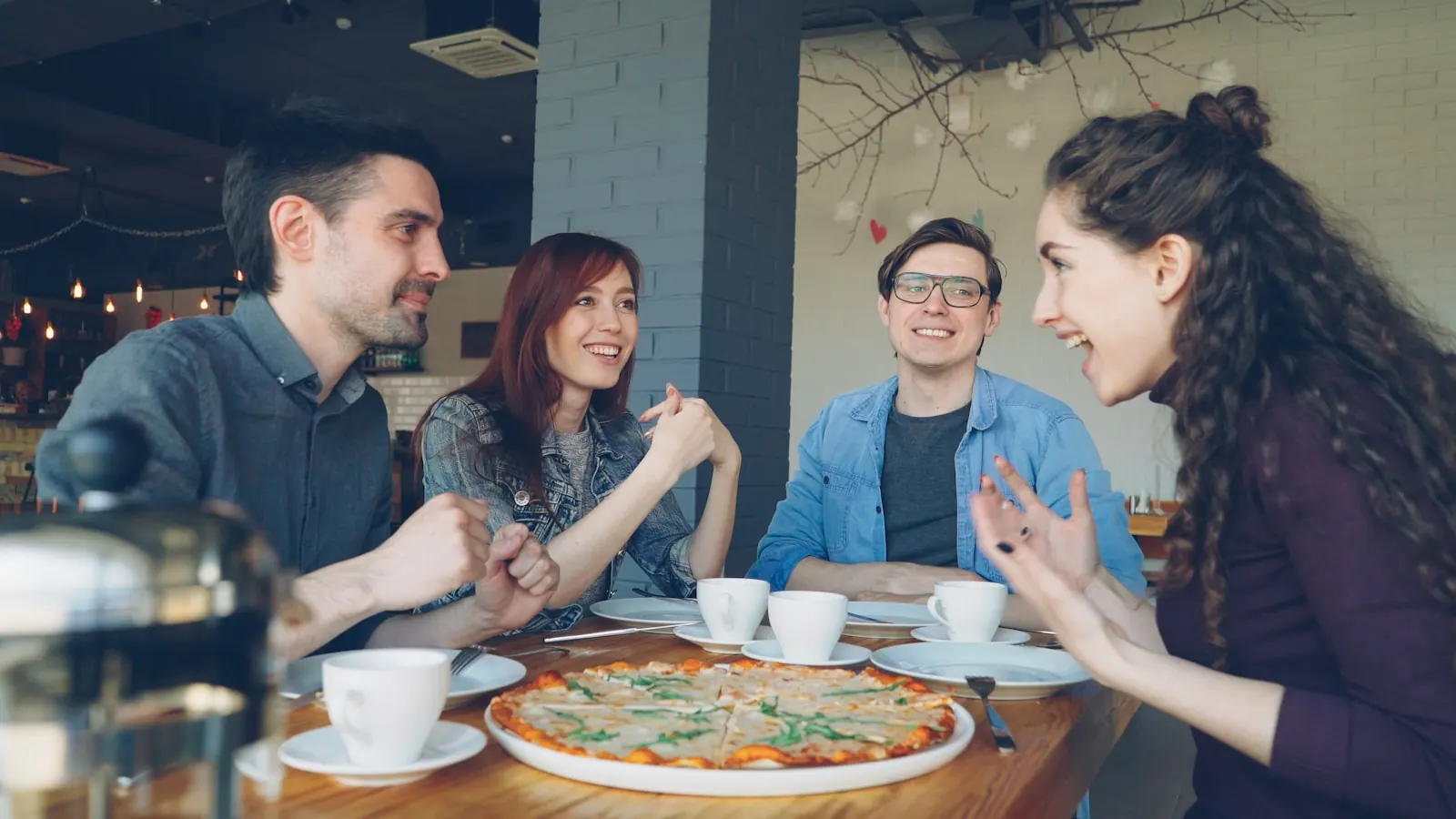 Friends sharing a meal and conversation