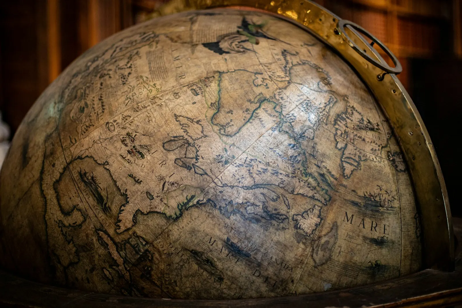 A detailed antique globe and its aged map