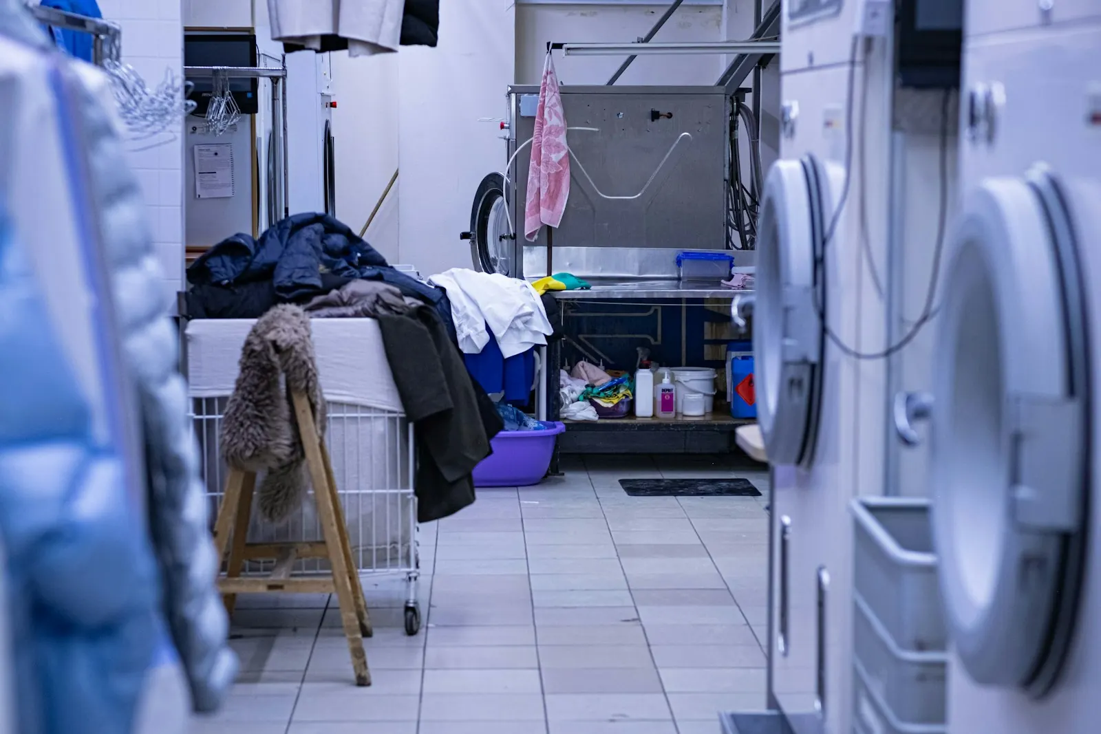 A working laundry room with washing machines