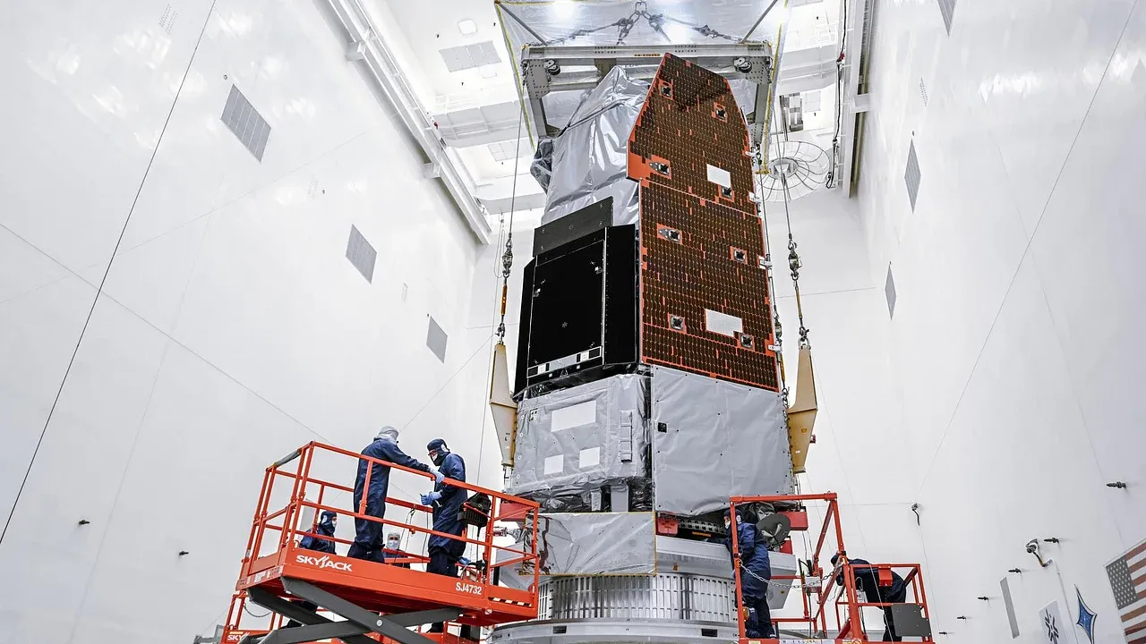NASA's complete Nancy Grace Roman Space Telescope standing in a brightly lit clean room at Kennedy Space Center before launch