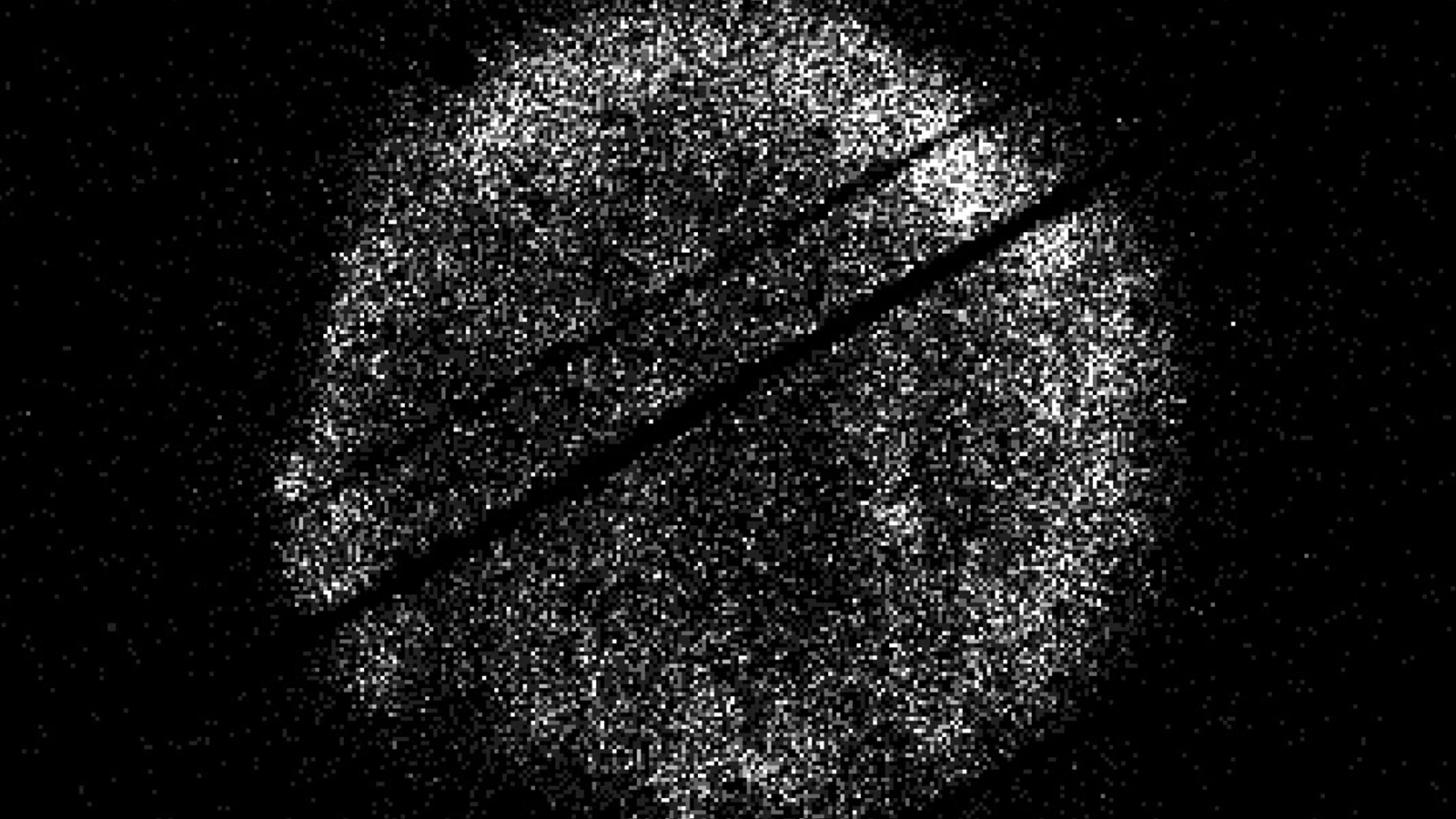 Swift's X-ray view of Tycho's supernova remnant, with white photon dots and dark imaging artifacts against black space