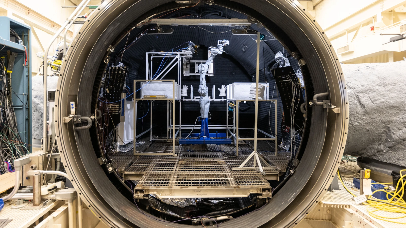 Real NASA thermal-vacuum test setup inside a chamber prepared for lunar hardware and dust testing