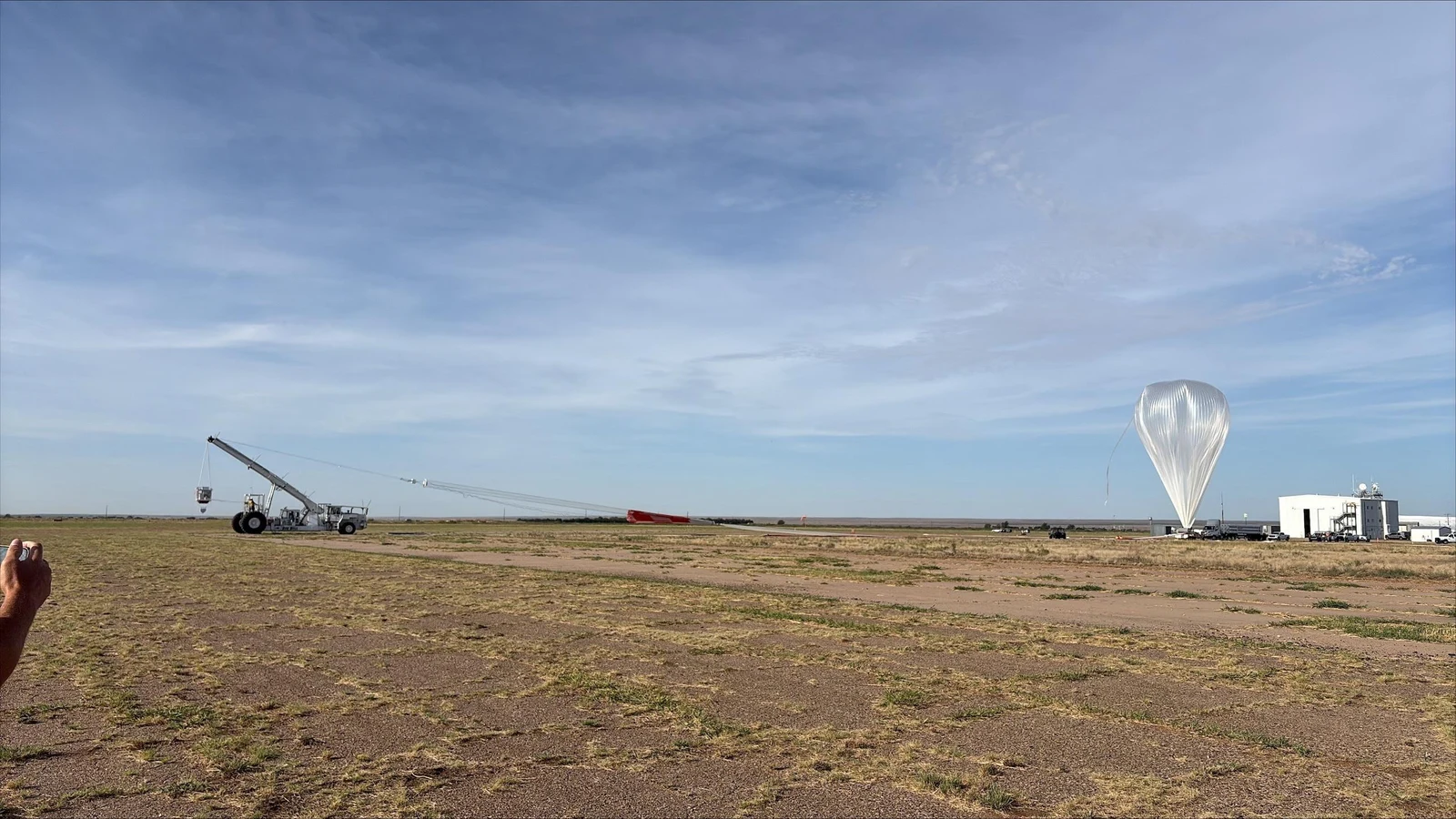 NASA photograph of the Salter scientific balloon lifting off during the Fort Sumner campaign, with its flight train visible against the sky
