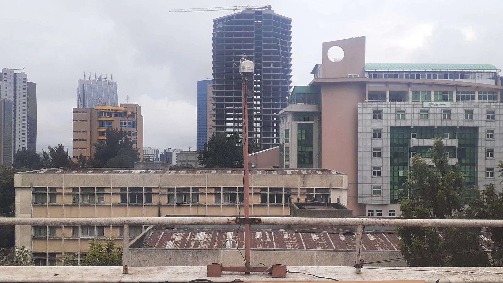 A NASA/JPL-Caltech photograph of a roof-mounted MAIA air sensor above the Addis Ababa city skyline