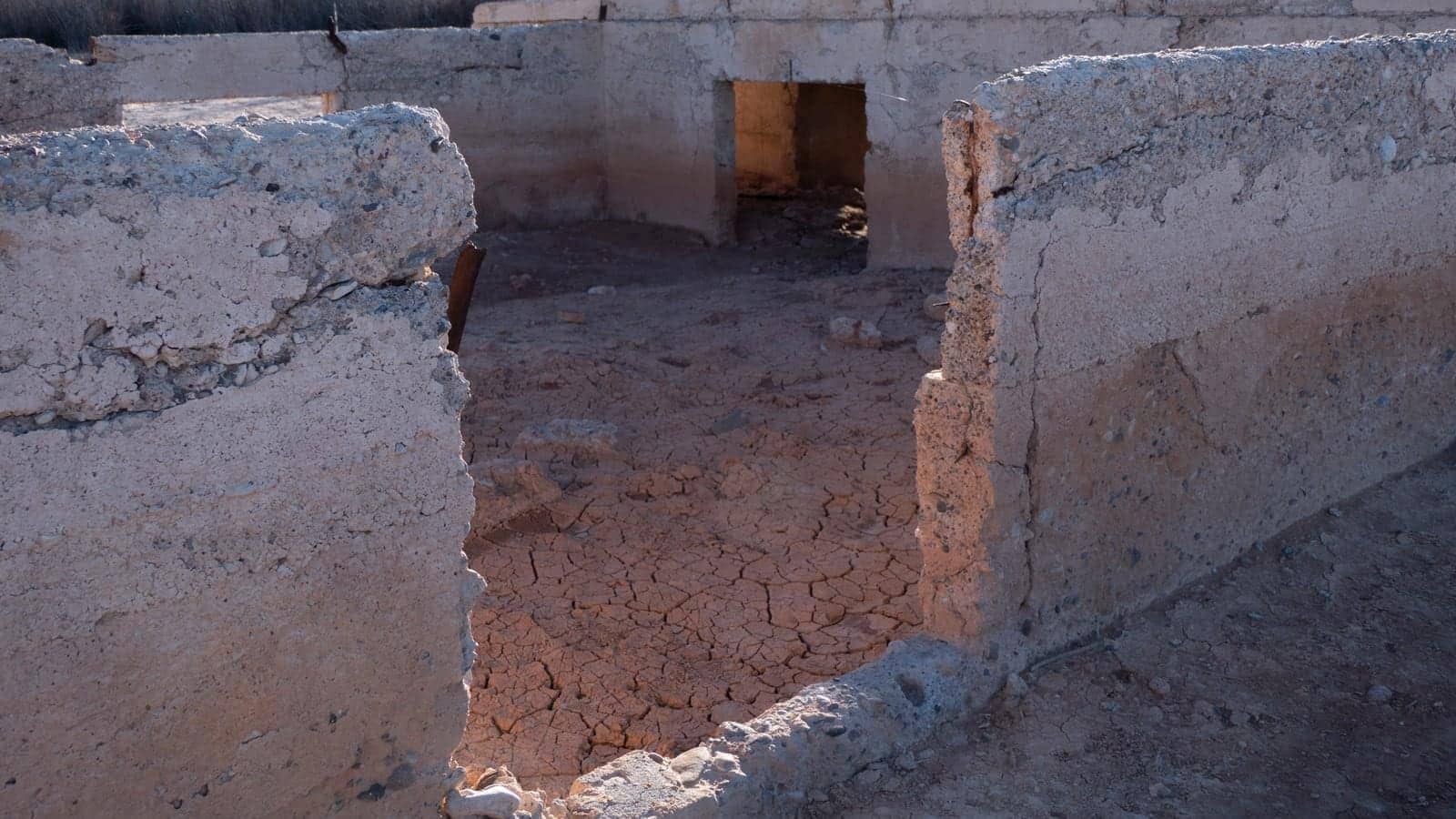 Low concrete foundation walls and cracked earth at the exposed St Thomas town site in Lake Mead National Recreation Area