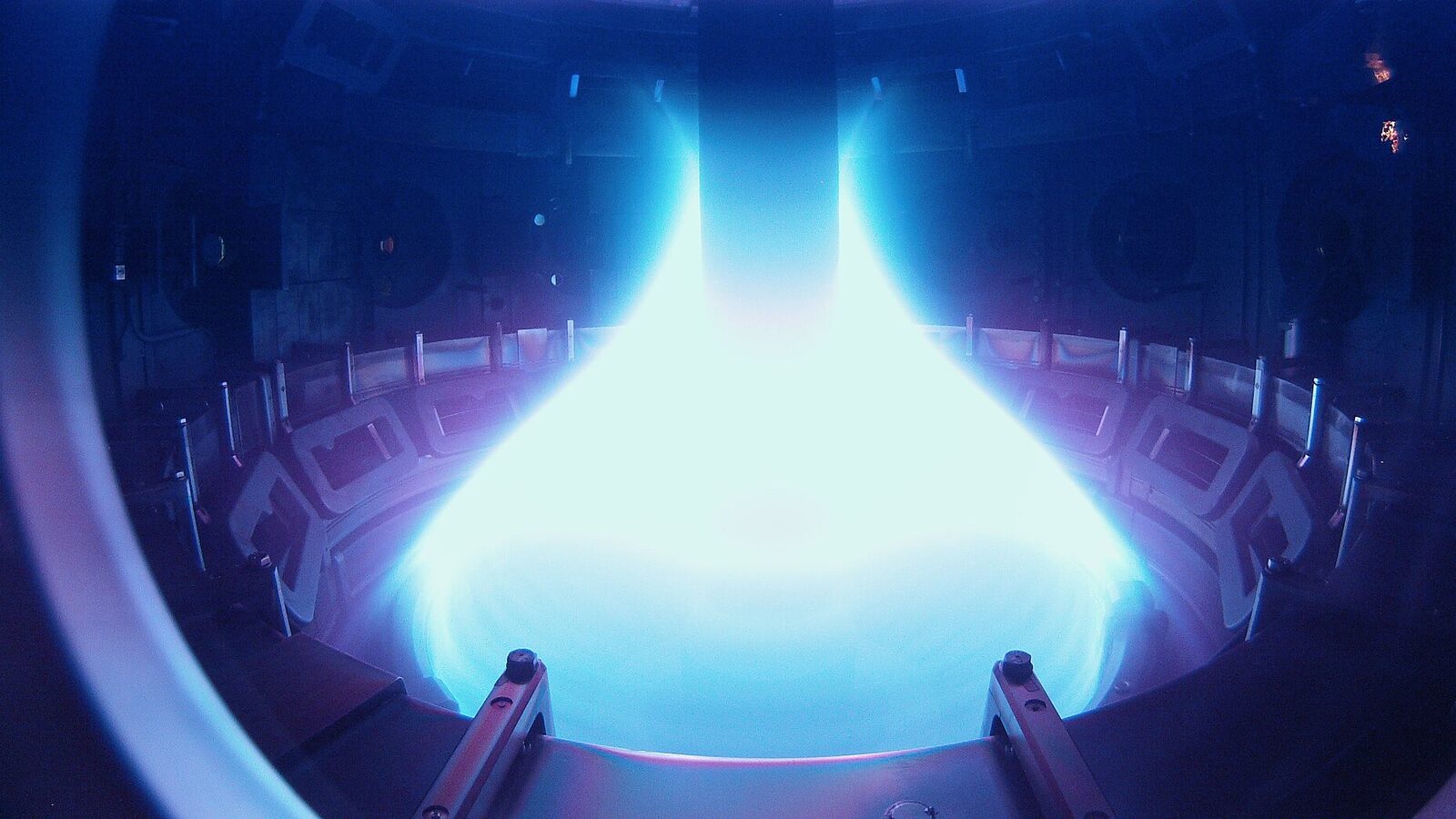 Bright blue-white plasma glowing inside the MAST spherical tokamak vessel at Culham in the United Kingdom