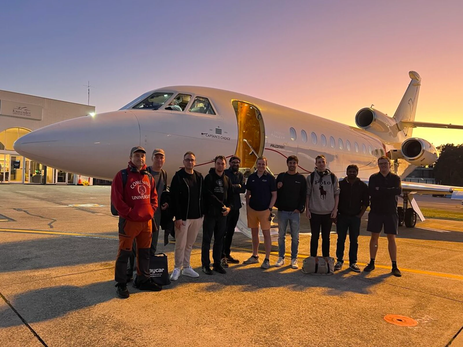 ESA re-entry science team standing in front of the aircraft used to observe an earlier Cluster satellite re-entry